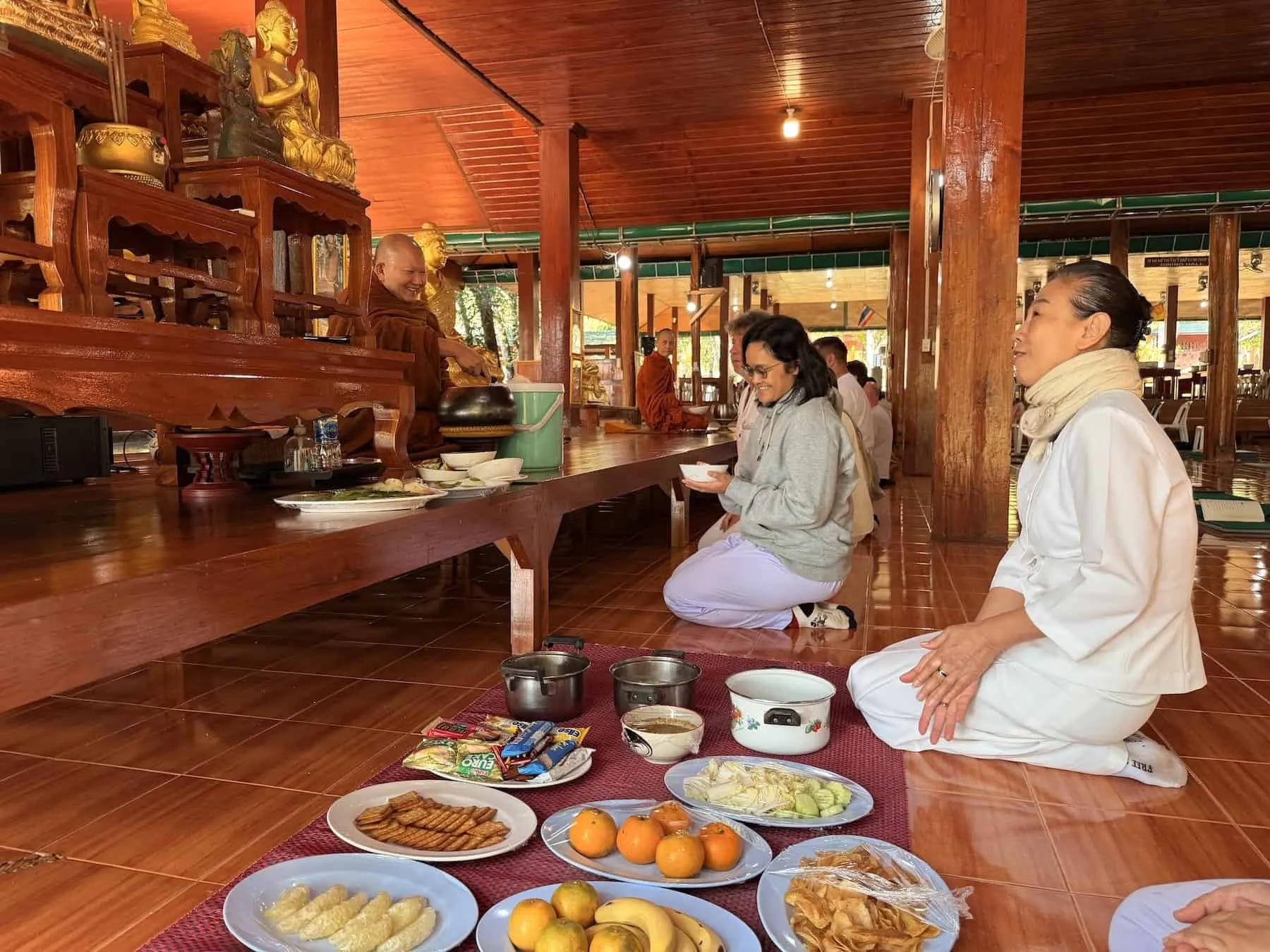 Monks receiving food offering
